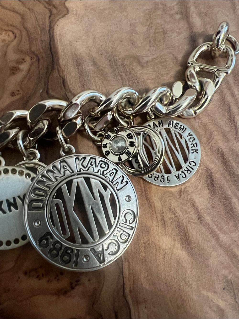DKNY Gold-Tone Charm Bracelet with Multiple Logo Discs - Picture 2 of 5